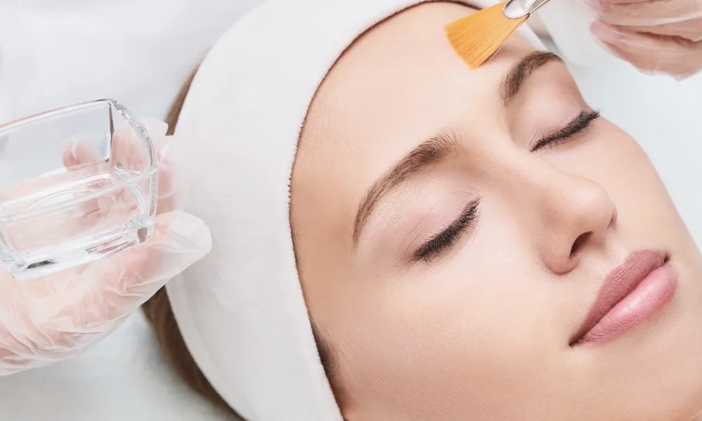 A professional applying a medical grade skincare treatment in Kent, WA